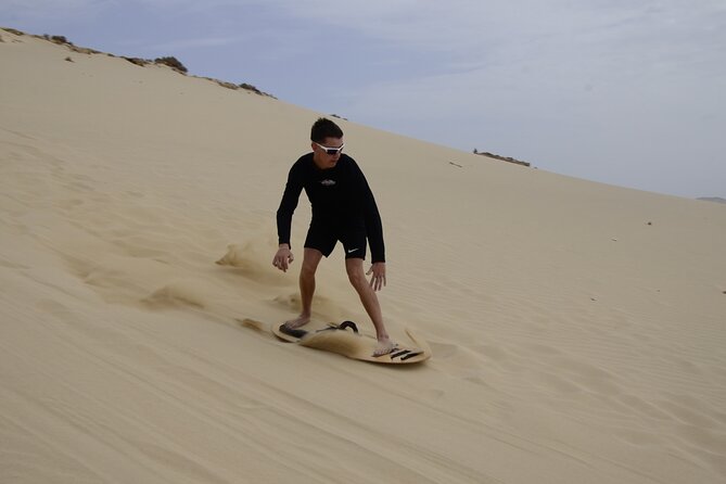 4x4 Tour - Sandboard, Shark & Green Turtle's Bay, Snacks & Drinks - Sandboarding down the big dunes
